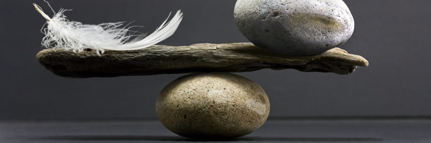 a feather and a stone equally balance