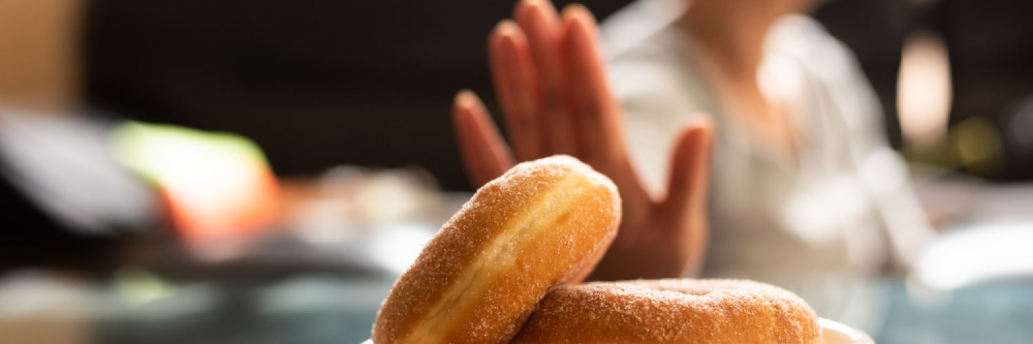 Asian woman reject eat donuts at home
