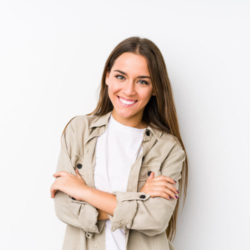 Young caucasian woman  isolated who feels confident, crossing arms with determination.