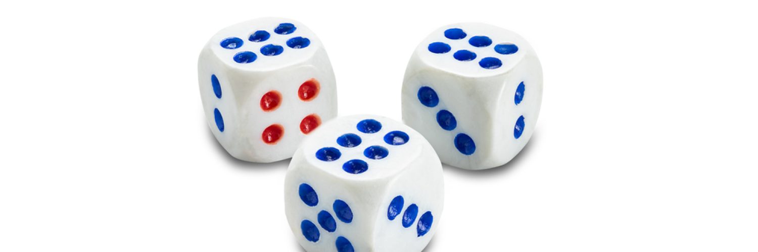 High angle view of three dice isolated on white background with clipping path, closeup, horizontal format.